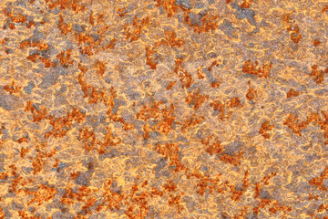 Rusty metal plate texture. Corrosion surface closeup with orange and grey tones. Old industrial...