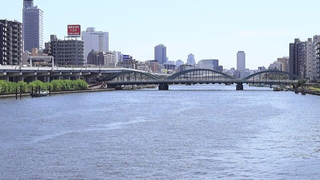View landscape building office tower architecture cityscape of Taito city with traffic road bridge crossing sumida river for japanese people travelers visit at Asakusa on July 21, 2025 in Tokyo, Japan