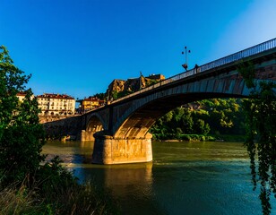 Naklejka premium Old stone bridge over a river