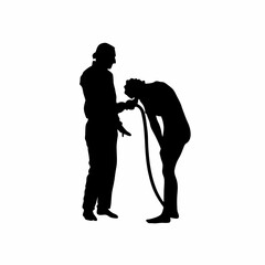 Silhouette of medical professional carefully removing tubing from patient