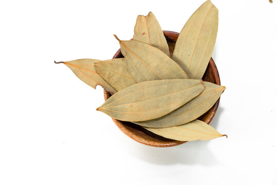 Dried bay leaves (Laurus nobilis) isolated on white background. It is also known as Tej Pata, Cassia leaves, Cinnamomum tamala