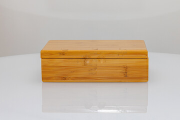 Board Game in Closed Bamboo Box at White Table