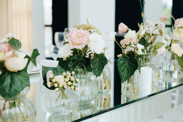 Elegant floral arrangements adorn a stylish dining table setting