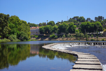Close-up of a footpath made of stone slabs across the Tamega River in Amarante called 