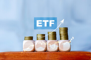 ETF investment growth concept with stacked coins and upward arrow, symbolizing wealth building,...