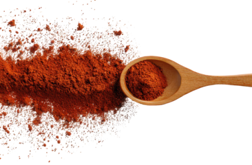 Red Spice Explosion Wooden Spoon Black Background