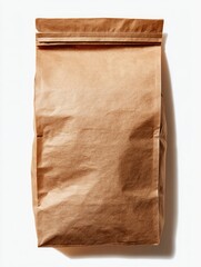 A light brown, rectangular paper bag with a folded top closure, slightly wrinkled, sits on a white background, casting a subtle shadow