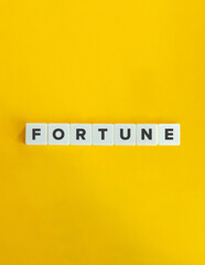 Fortune Word on Letter Tiles with Yellow Background