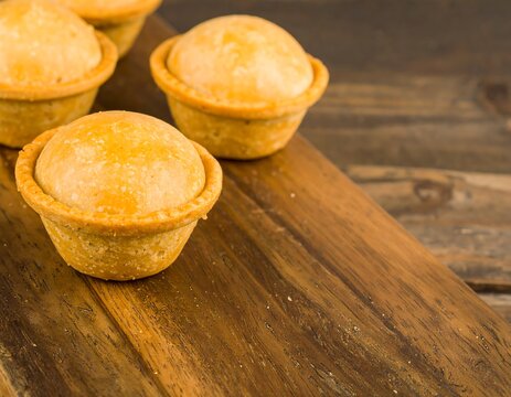 Fresh pies on a wooden board - Powered by Adobe