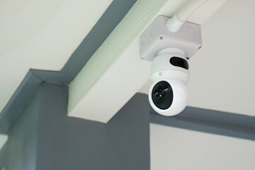 CCTV security camera or surveillance system on the ceiling in office.