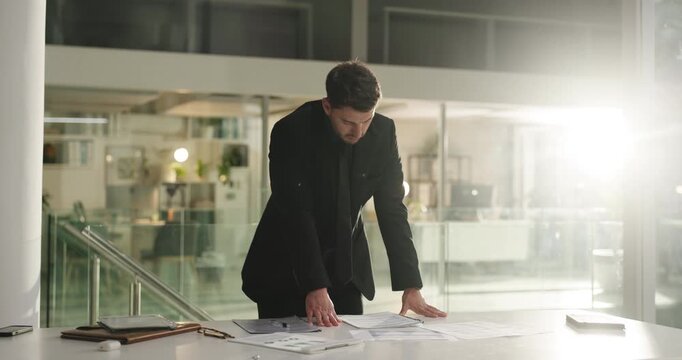Business, man and planning with documents at night for legal form review, gather evidence or flare. Attorney, thinking and paperwork preparation in office for case management, compliance and deadline