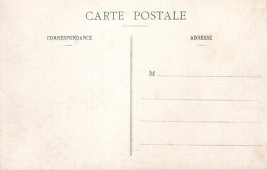 Blank vintage postcard with French text, featuring sections for correspondence and address. Aged...