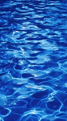 Obraz premium Abstract shimmering blue water with rippling light creating a mesmerizing pattern, depth, and movement in a refreshing and calming scene