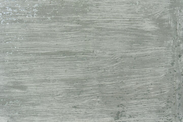 Fototapeta premium Close-up of an old sheet of metal carelessly covered with paint. Brush marks are visible. Background. Texture.