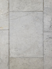 White marble tile surface with natural texture.