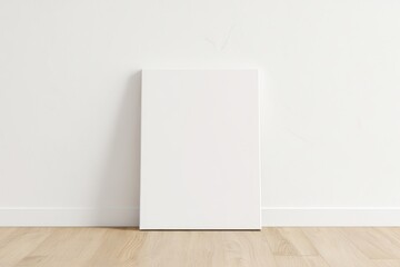 Blank Canvas Mockup on Wooden Floor Against White Wall