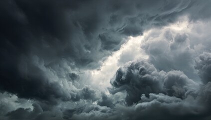 Obraz premium Dark, ominous clouds fill the sky, with hints of light breaking through