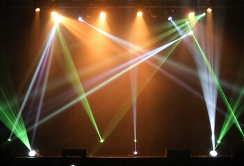 stage spotlight with laser rays concert lighting background