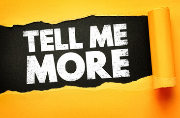 Bold white grunge text TELL ME MORE on a black background, revealed through torn yellow paper....