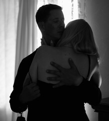 Couple during intimate moments in bedroom