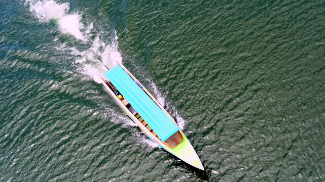 Aerial Adventure Vibrant Boat Journey Across Shimmering Water, Embracing Natures Beauty and Outdoor Tranquility in Thailands Scenic River Waves