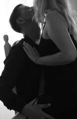 Couple during intimate moments in bedroom