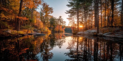 Sunset in Autumn Forest with Waterway and Colorful Reflection on lake