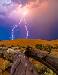 Dramatic lightning storm over desert dunes