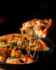 Cheese Pizza Slice Being Lifted with Melted Cheese Strings