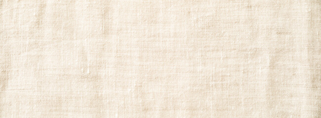 Background. Textured linen fabric close-up showcasing natural fibers and neutral tones.