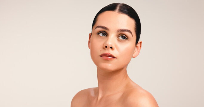 Thinking, woman and beauty with skincare in studio for reflection, cosmetics ideas and natural glow. Vision, person and mockup space with healthy skin, facial shine and treatment on white background