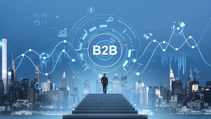 Businessman looking at B2B concept over Manhattan skyline with d