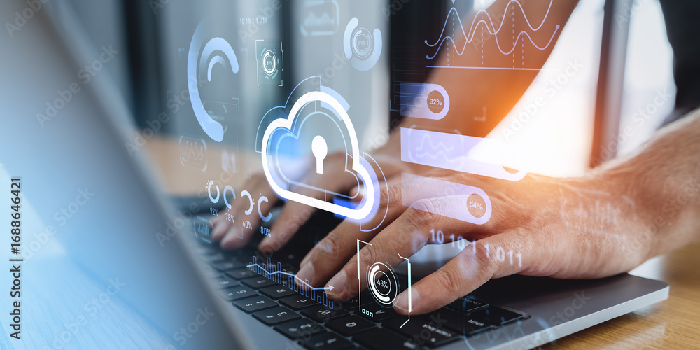 Poster hands typing on laptop with cloud storage interface and data graphics overlay.