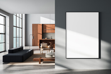 Modern interior with large blank poster on wall in stylish open-plan living room and kitchen with natural wood and minimalist furniture decor. 3D Rendering