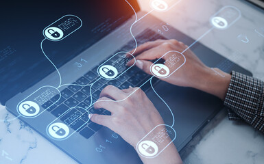 Hands typing on laptop with digital padlock icons representing cybersecurity protection and data encryption concept overlayed on abstract background.