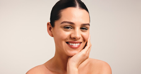 Portrait, skincare and glow with happy woman in studio for beauty, shine or dermatology. Face,...