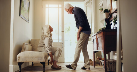 Assistance, conversation and retirement with senior couple in entrance hall of home for help. Getting ready, morning and shoes with old people in apartment together for daily routine or preparation