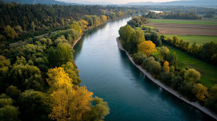 Tranquil Mountain River Amid Lush Forests During Vibrant Fall Season