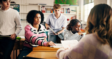 Group, education and students in classroom for college study, project team and feedback. Communication, knowledge and people with collaboration in high school for lesson or scholarship support