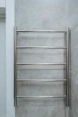 Stylish and elegant Stainless Steel Towel Warmer that is conveniently mounted on the wall of your...