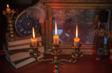 Candles burns on the altar, magic among candles, clean negative energy, wicca concept	