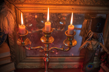 Candles burns on the altar, magic among candles, clean negative energy, wicca concept  © T.Den_Team