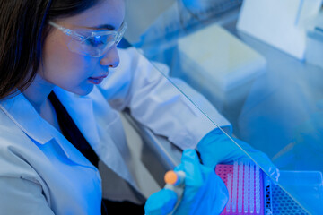 Lab technician conducts experiments in a modern laboratory during the day, focusing on precision and accuracy in chemical testing