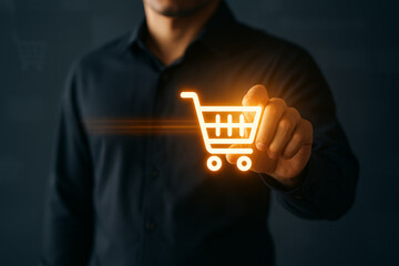 Businessman touching glowing shopping cart icon, representing digital retail, e-commerce, and online shopping technology