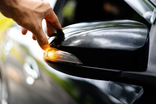 Car service check Car side view mirror or wing mirror, turn direction signal indicator LED light on door