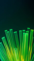 Glowing green tubular fibers rise against a dark gradient background, forming an abstract, futuristic pattern suggestive of fiber-optic technology and high-speed data transmission.