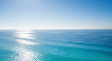 Obraz premium Bright blue sea with sun reflecting on the surface on a clear day