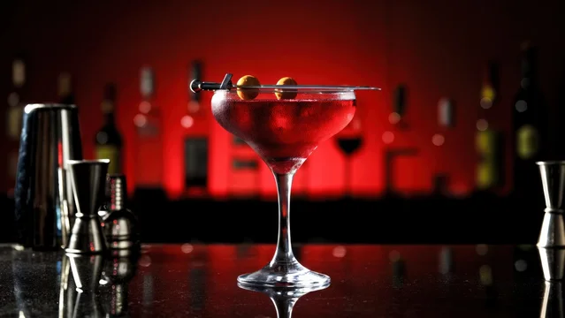 Bloody Halloween Martini with Olive and Dagger Garnish