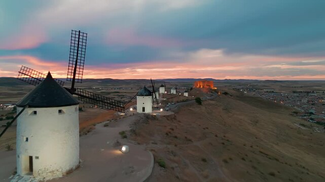 Aerial view of the windmills of Consuegra at night, Castilla-La Mancha, Spain.