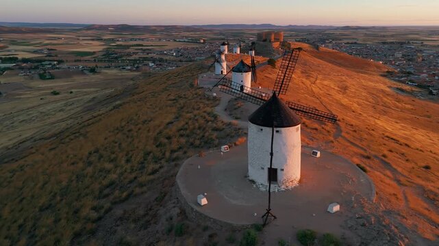 Aerial view of the windmills of Consuegra at sunrise, Castilla-La Mancha, Spain.